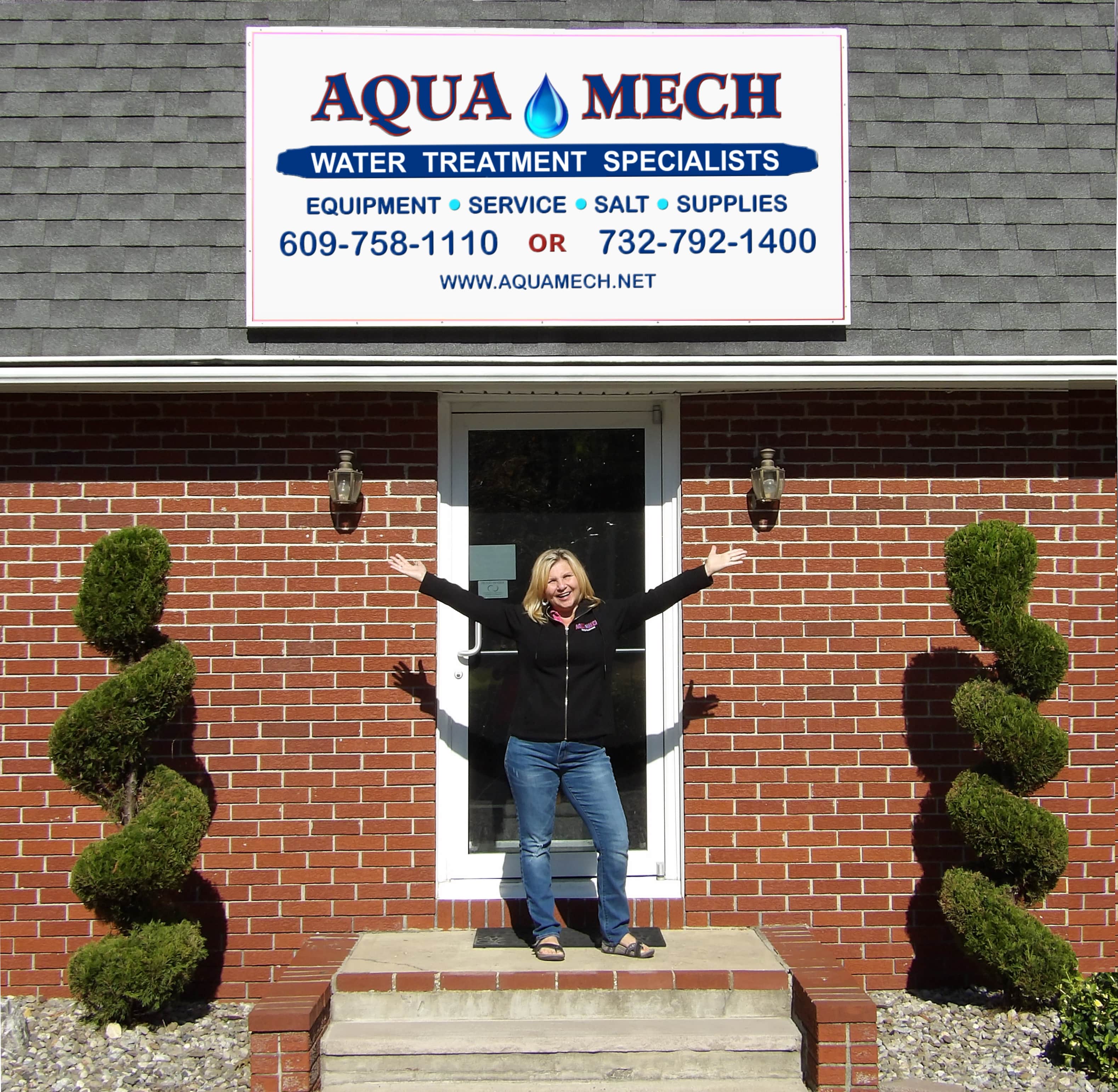 Denise Carabetta, CWR in front of the door of Aqua Mech; Cream Ridge, NJ.