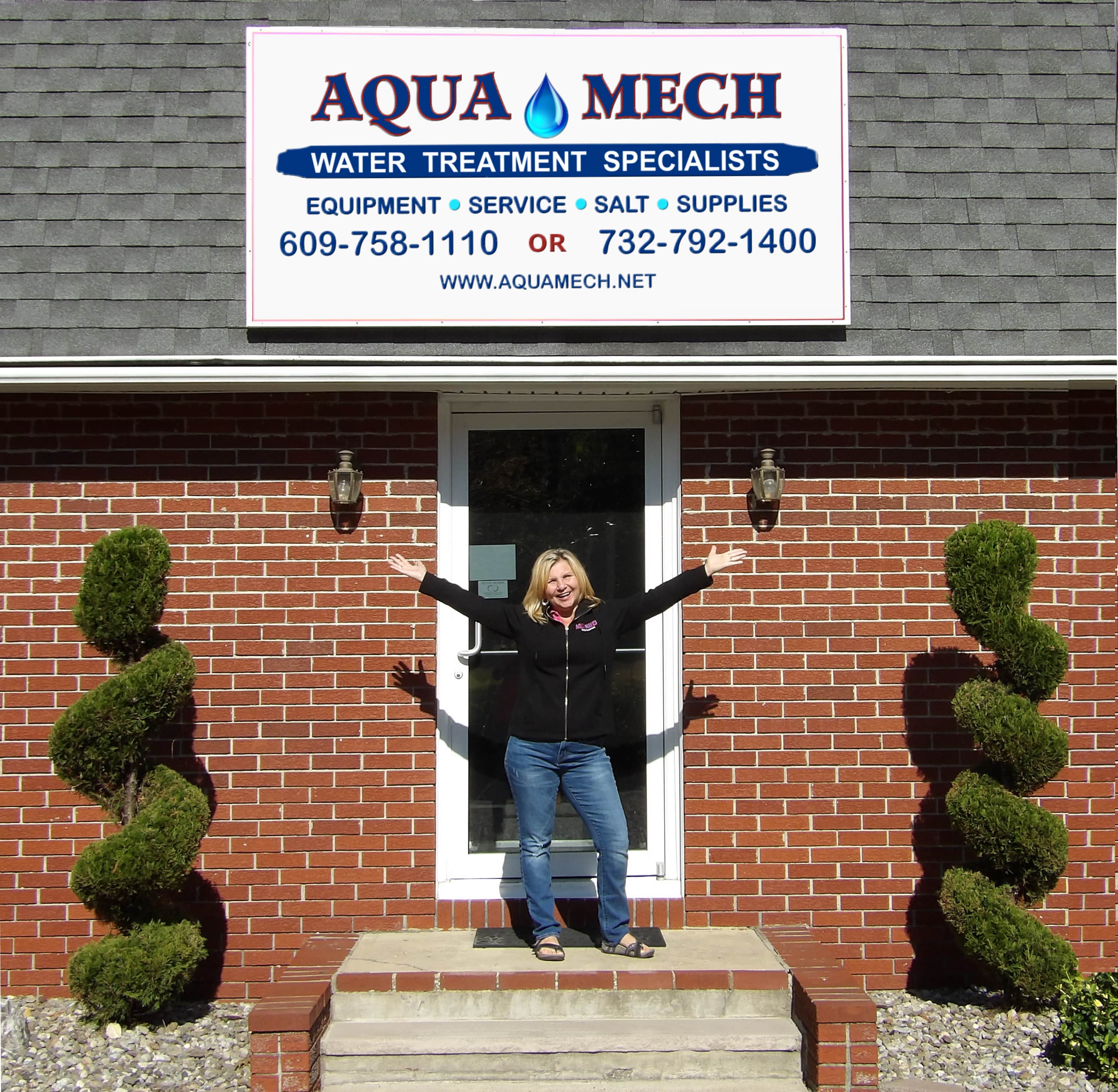 Denise Carabetta, CWR in front of the door of Aqua Mech; Cream Ridge, NJ.